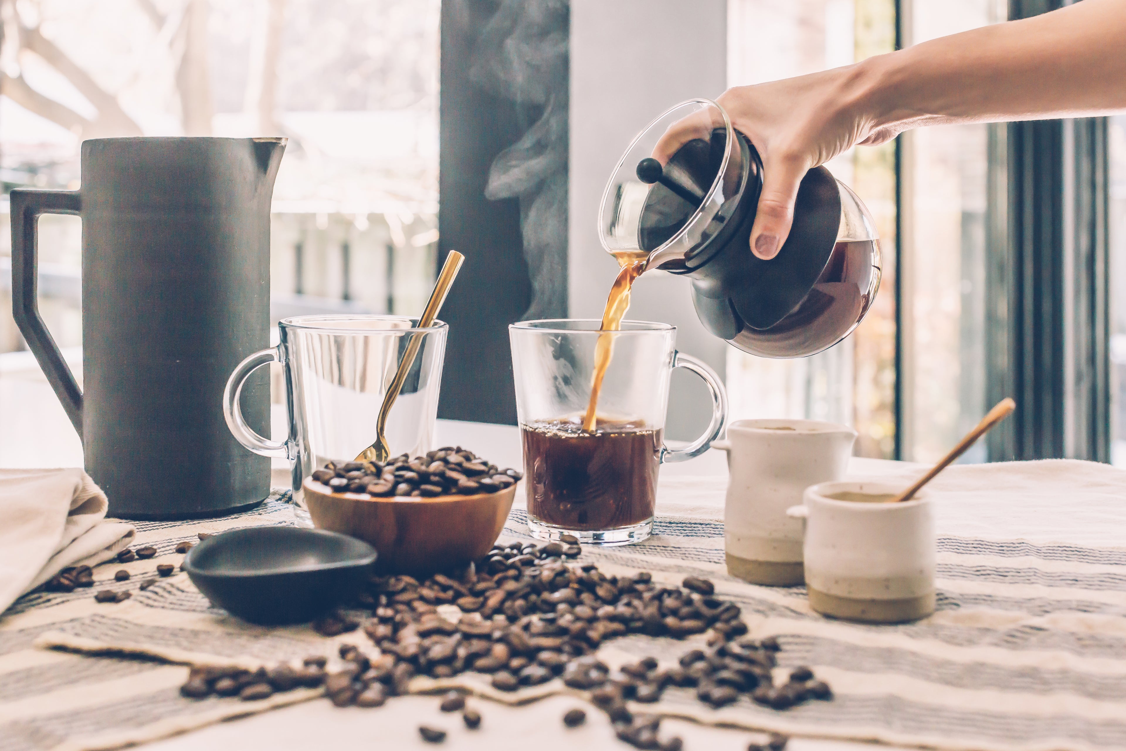 Filter coffee being poured into mug