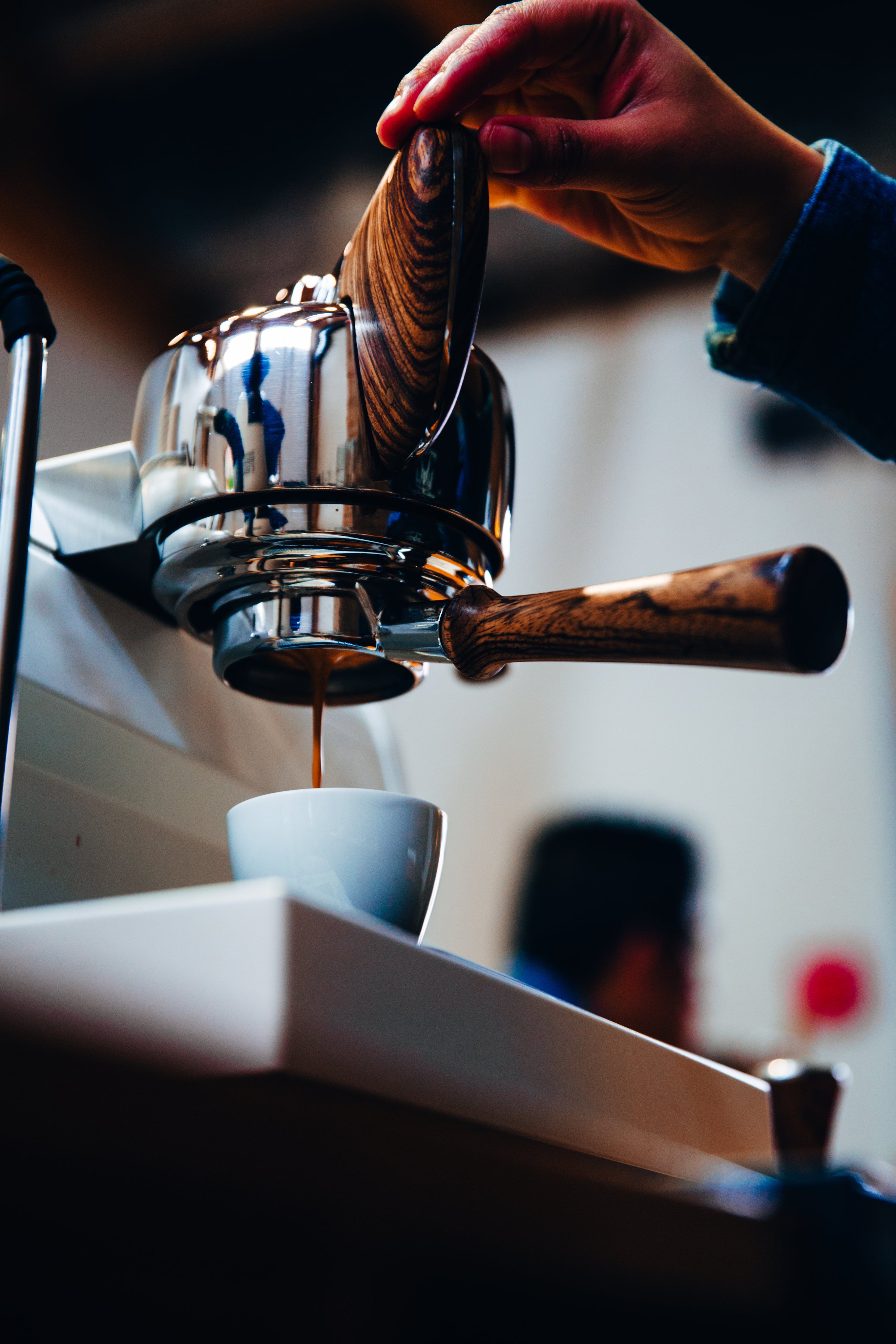 espresso machine with dark wood handle