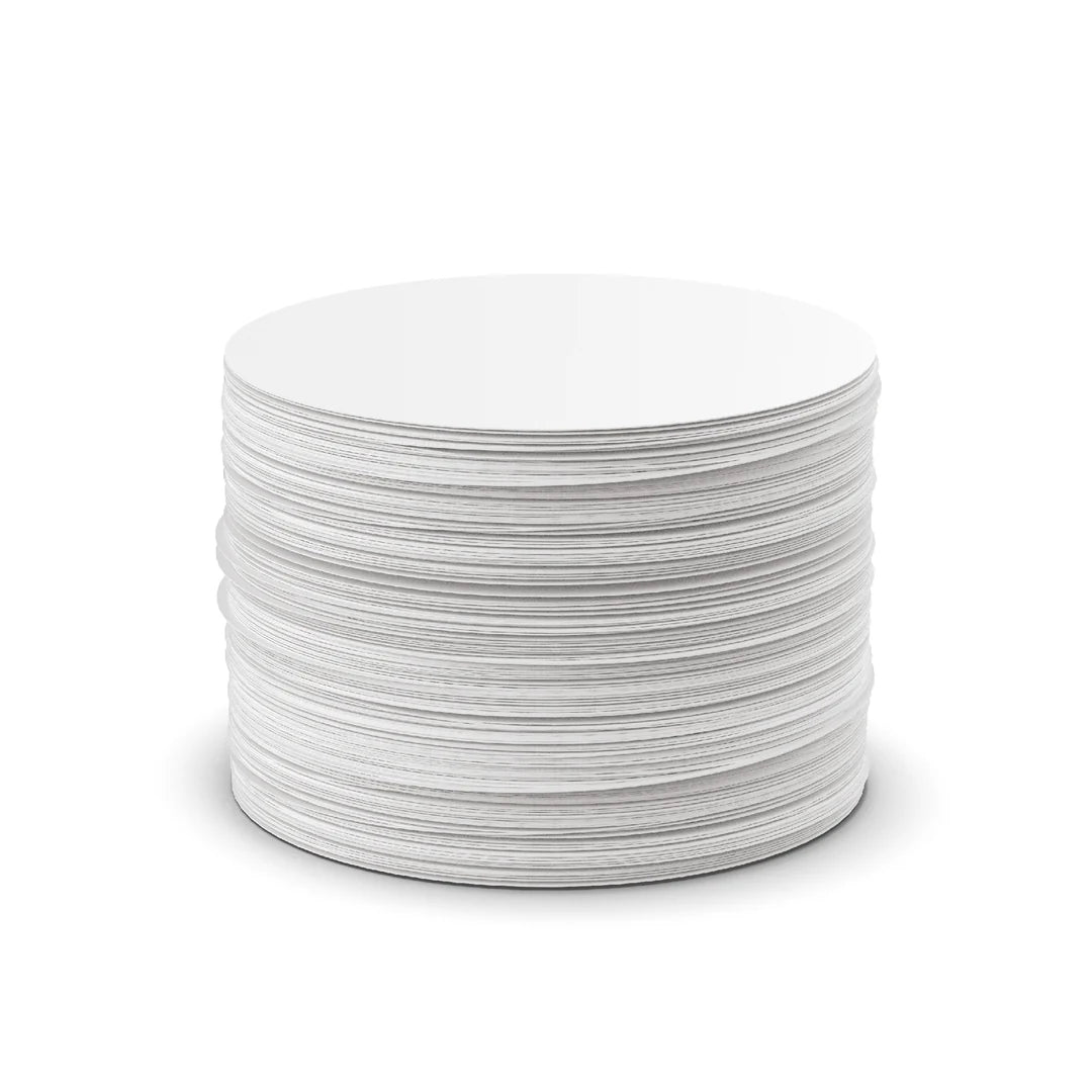 stack of Aeropress coffee filters on white background