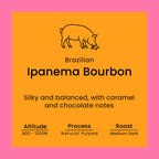 Coffee label for Brazilian Ipanema Bourbon with pig illustration on orange background
