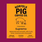Colombian Supremo coffee label with pig icon on orange background