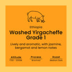 An orange square label with a simple black line drawing of a pig and text reading 'Ethiopia Washed Yirgacheffe Grade 1' plus descriptive flavor notes and roast/altitude details.