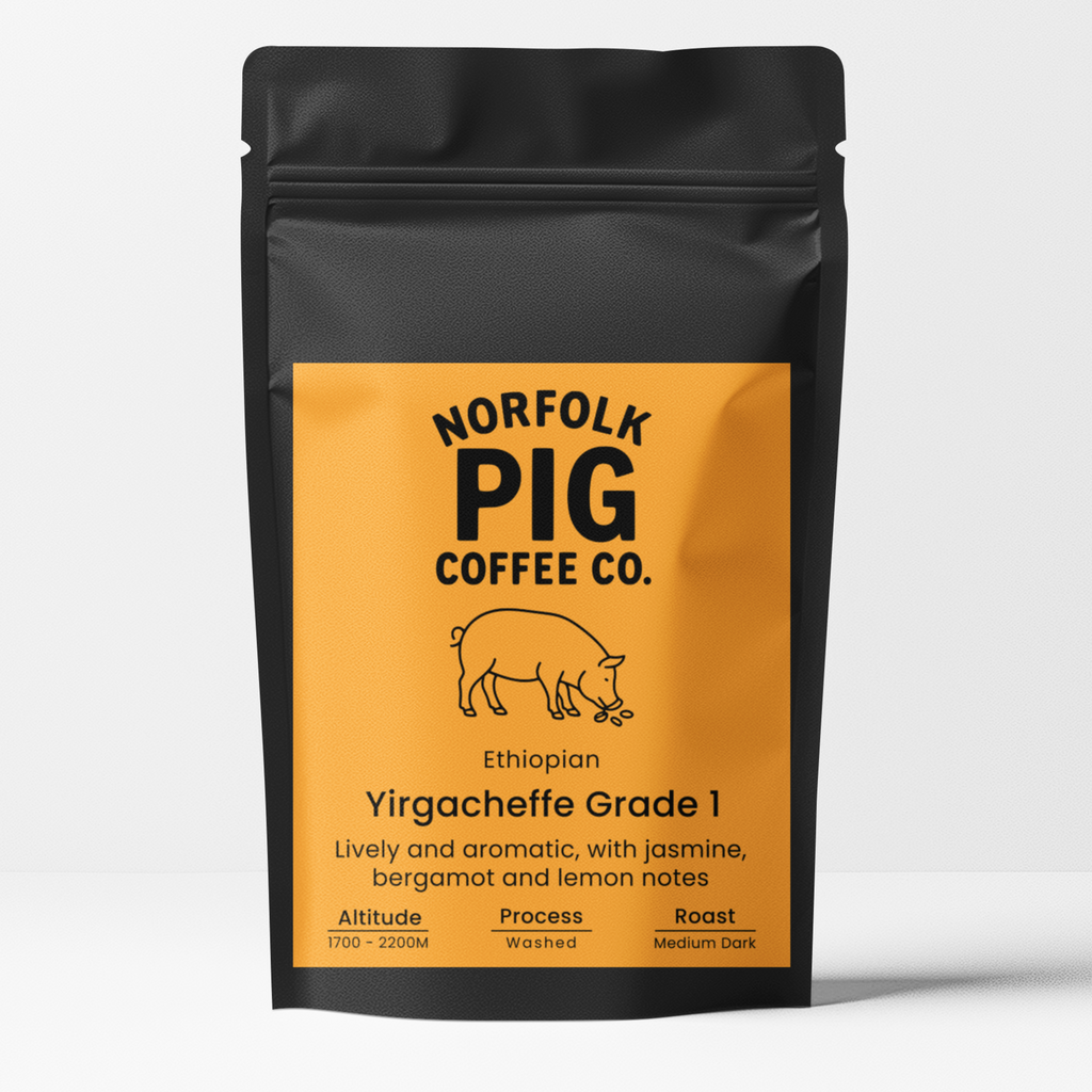 A black stand-up coffee bag with a large orange label reading Norfolk Pig Coffee Co. and Ethiopia Yirgacheffe Grade 1, shown on a clean white background.