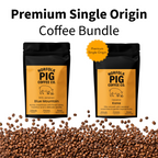 Two black coffee bags from Norfolk Pig Coffee Co. on a white background with a pile of coffee beans at the bottom.